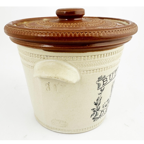 77 - BUTTERCUP DAIRY CO CROCK WITH LID. 6.7ins tall. Dark brown top, two side handles, black transfer. 3l... 