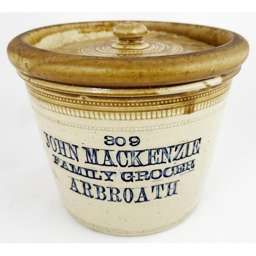 79 - JOHN MACKENZIE ARBROATH BUTTER CROCK WITH LID. 7.2ins diam. Tan top, 4 blue impressed lines: 309/ JO... 