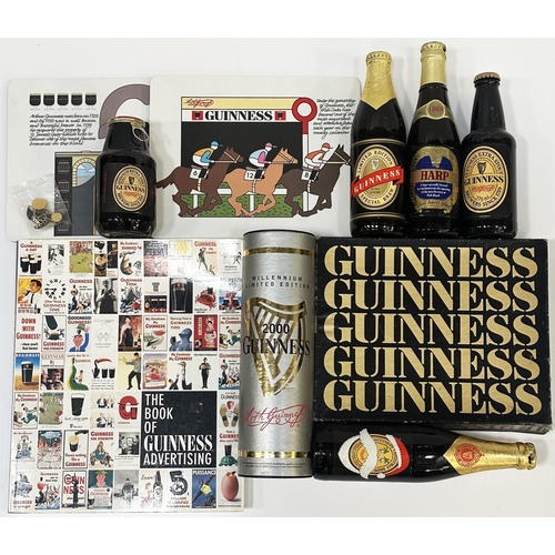73 - GUINNESS GROUP. Book, boxed mats, full labelled bottles & badges. Slightly worn. (11)