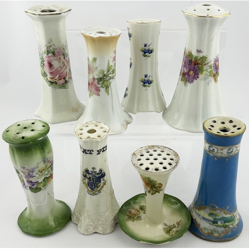 94 - CERAMIC HAT PIN HOLDERS GROUP. Tallest 5.5ins. Various floral designs. Damages. (8)