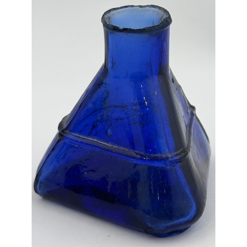 9 - DERBY INK BOTTLE. 2.25ins tall. Blue glass, embossed.