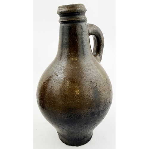 362 - BELLARMINE.8.5ins. Dark salt glaze bellarmine jug, wire cut base, small kiln touch to one side but o... 