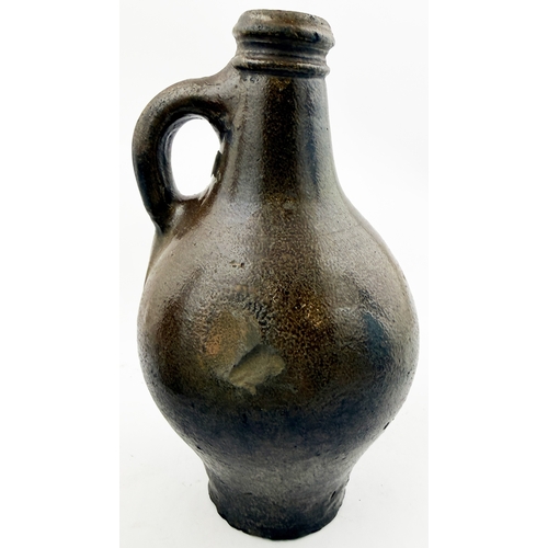362 - BELLARMINE.8.5ins. Dark salt glaze bellarmine jug, wire cut base, small kiln touch to one side but o... 