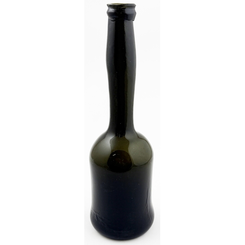 375 - LADIES LEG WINE BOTTLE. 10.2ins tall. Black glass, long slender ladies leg neck & sagged base. Form ... 