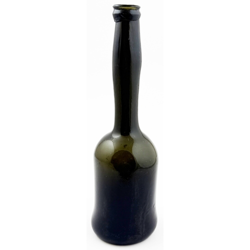 375 - LADIES LEG WINE BOTTLE. 10.2ins tall. Black glass, long slender ladies leg neck & sagged base. Form ... 