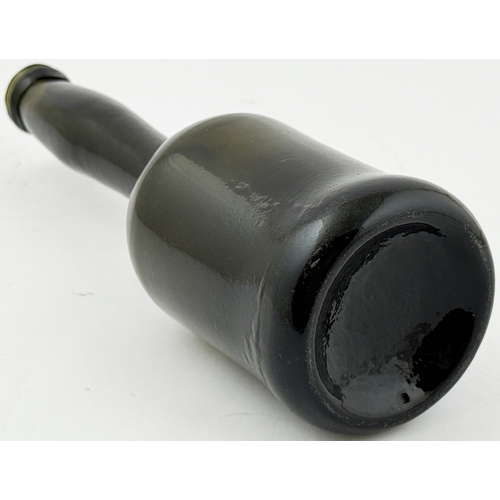 375 - LADIES LEG WINE BOTTLE. 10.2ins tall. Black glass, long slender ladies leg neck & sagged base. Form ... 