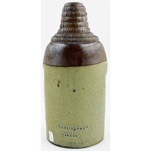 377 - OLD TOM REFORM FLASK. RF p32. 8.5ins tall. Grey-green glaze flask modelled as a toper sitting astrid... 