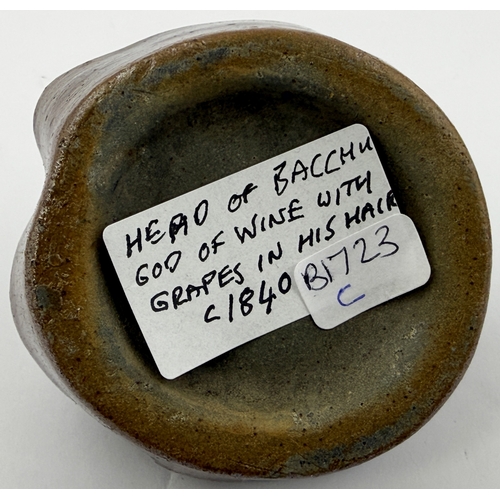 389 - BACCHUS HEAD INK BOTTLE. 2.4ins tall. Shiny salt glaze ink modelled as Bacchus, Roman God of wine. T... 