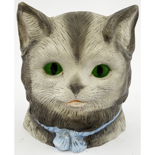 394 - CAT NIGHT LIGHT. 3.5ins tall. Bisque nursery night light holder modelled as cat, with inset green gl... 
