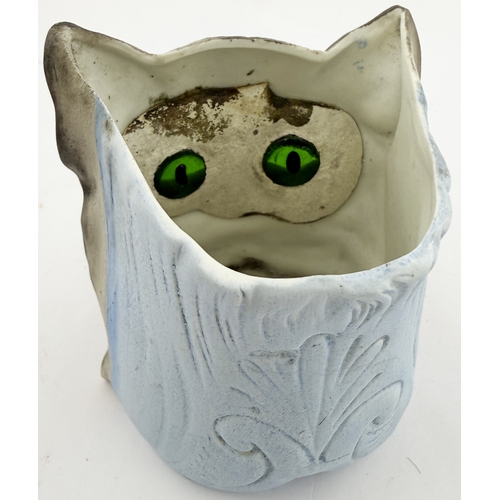 394 - CAT NIGHT LIGHT. 3.5ins tall. Bisque nursery night light holder modelled as cat, with inset green gl... 
