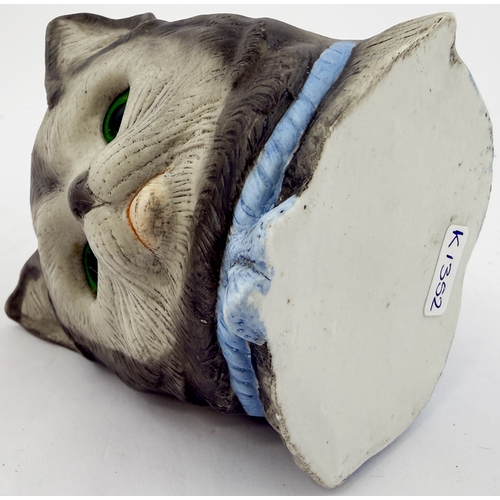 394 - CAT NIGHT LIGHT. 3.5ins tall. Bisque nursery night light holder modelled as cat, with inset green gl... 