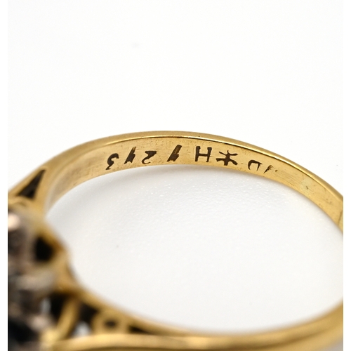 105 - An 18 carat gold sapphire and diamond dress ring, finger size M 1/2, 3 grams gross.
