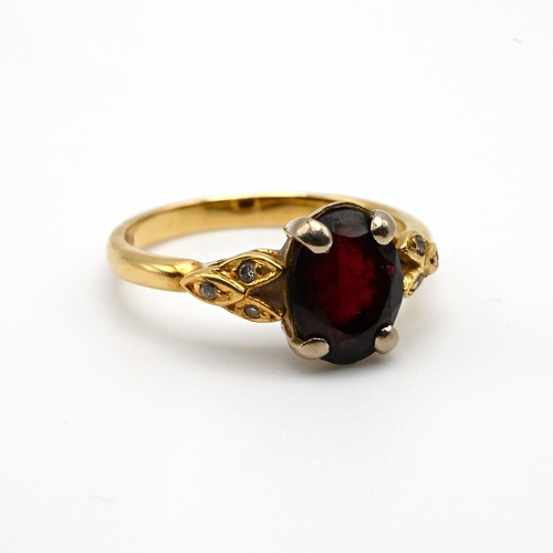 107 - An 18 carat gold garnet and diamond dress ring, finger size N, 3.9 grams gross.