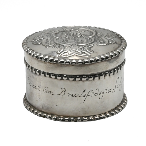 115 - A Dutch box, with stamped marks, circa 1900, circular outline, the pull off cover embossed with a co... 