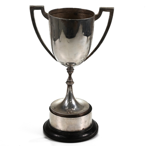 123 - A silver two handled trophy cup, inscribed, on a ‘silver’ mounted plastic base, weight of weighable ... 