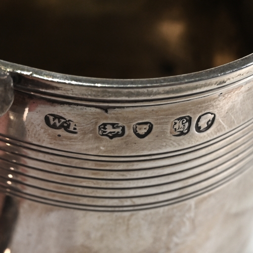 126 - A Victorian silver mug, William Brown, London 1843, of can shape with reeded bands, double scroll le... 