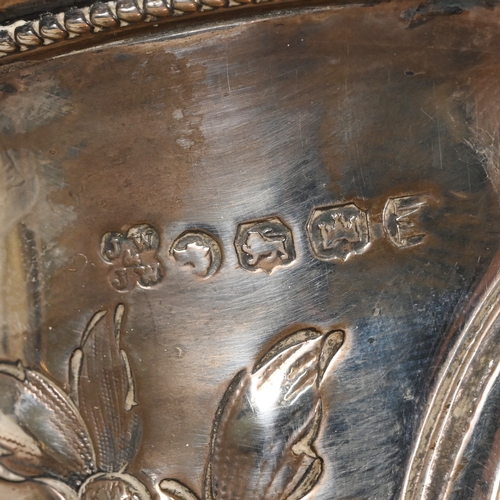 129 - A Victorian Exeter silver two handheld trophy cup, James and Josiah Williams of Bristol, 1868, embos... 