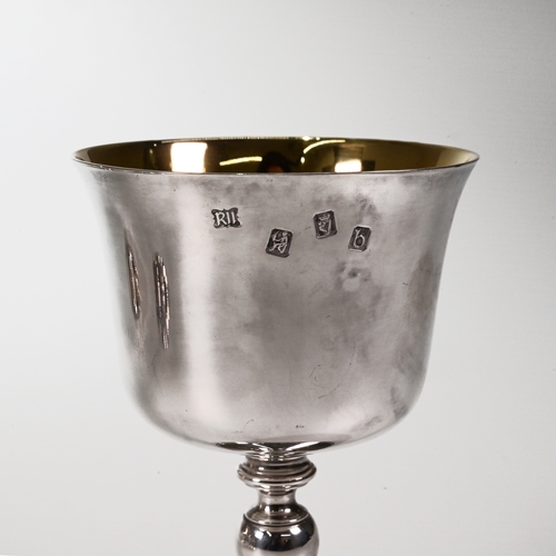 131 - A silver wine jug with a matched set of six silver wine goblets, and a larger goblet, Royal Irish Si... 