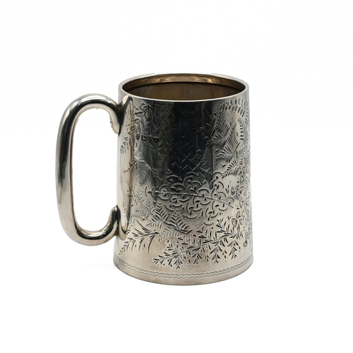 133 - An Edwardian silver mug, by the Haseler Brothers, Chester 1909, the can shaped body with C handle en... 