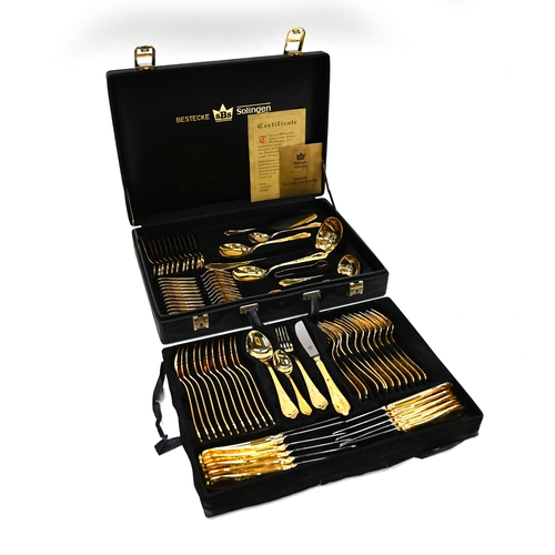 143 - A Bestecke gold plated canteen of cutlery by SBS of Solingen, comprising a 12 place setting, in two ... 