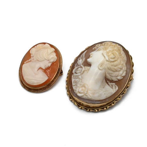 15 - A shell cameo brooch in a mount stamped ‘9kt’; with another smaller 9 carat gold mounted cameo brooc... 