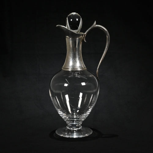 151 - A silver mounted glass claret jug, maker ‘JA”, London 2000, with stopper, 31 cm high.
