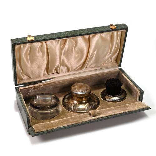 158 - A boxed silver desk set comprising: a silver and glass stamp moistener hallmarked I.M Hutchfield 192... 