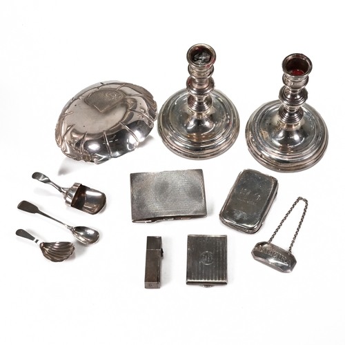 160 - A collection of various silver items to include; A small strawberry dish; two silver cigarette cases... 