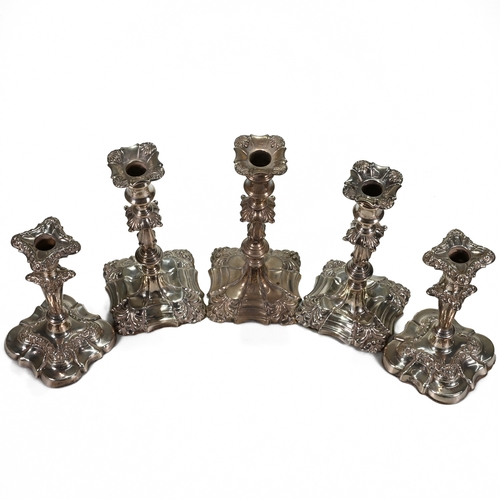 163 - A trio of Georgian style loaded silver candlesticks, Thomas Bradbury & Son, London 1908, 22.5 cm hig... 