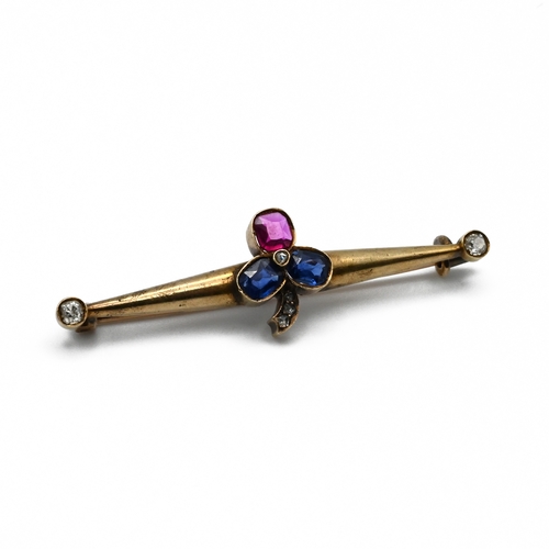 17 - A Russian sapphire, ruby, and diamond bar brooch, the stone set clover motif with old cut diamond te... 
