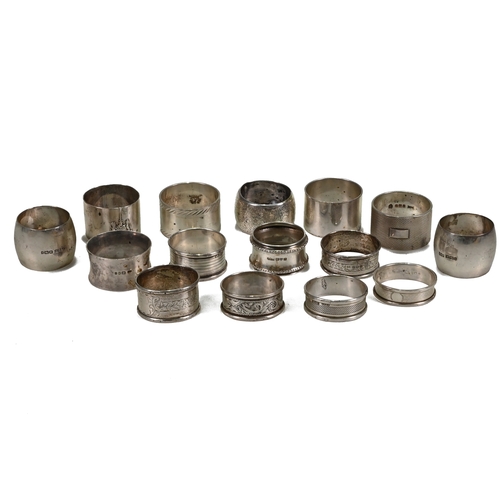 170 - A collection of fifteen silver napkin rings, including one pair, various dates, makers and styles, 4... 