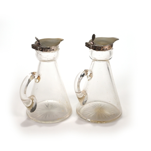 173 - A pair of silver mounted glass whisky noggins, Goldsmiths and Silversmiths Co Ltd, London 1912, 11.5... 