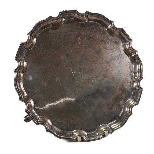 196 - A silver salver, Aide Brothers, Birmingham 1932, with a shaped moulded rim, on three supports, monog... 