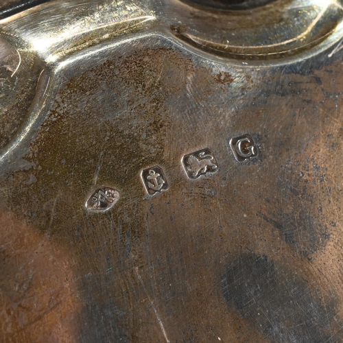 196 - A silver salver, Aide Brothers, Birmingham 1932, with a shaped moulded rim, on three supports, monog... 