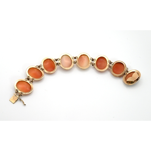 2 - A shell cameo bracelet, the seven oval panels mounted ion yellow metal, stamped ‘K14’ to thecatch to... 