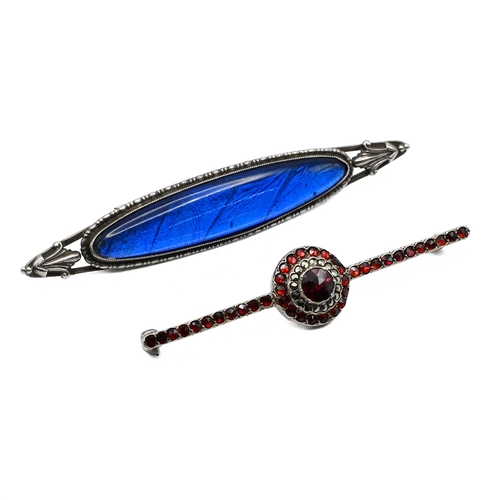 21 - A garnet and marcasite set bar brooch; with a butterfly wing mounted brooch.