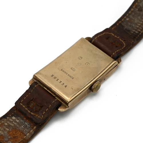 217 - A 9 carat gold jump hour gentleman’s wrist watch, showing hours and minutes, monogrammed, the two pi... 