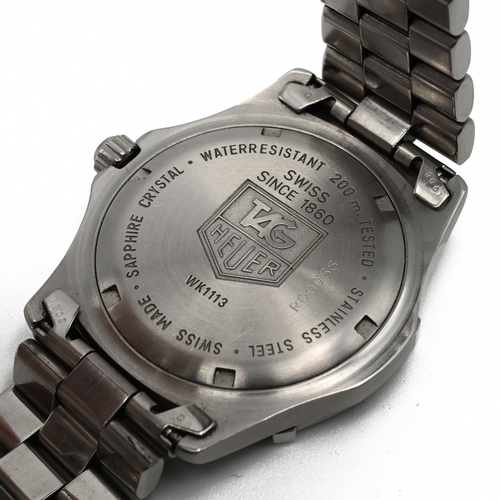 228 - Tag Heuer, Professional, a gents stainless steel quartz bracelet watch, the case back numbered WK111... 