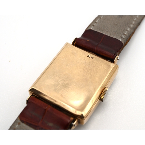 244 - Chalet, a gentleman’s 1940s mechanical wrist watch, stamped ’14k’, the rectangular dial set with red... 