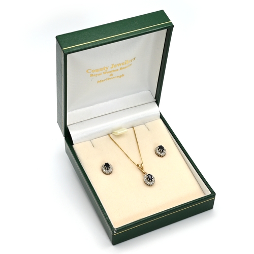 25 - A boxed 9ct gold matching earrings and necklace. (3)