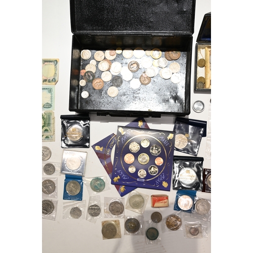 255 - A metal deed box with contents to include silver Morgan dollar, silver coffee bean teaspoon, silver ... 