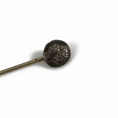 261 - A Persian style gold Daric coin, later mounted on a stick pin, along with one another silver coin wi... 