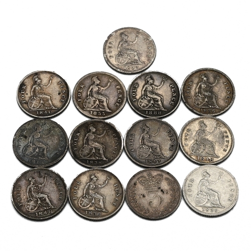 297 - A group of thirteen sterling silver fourpence (groats) and threepence coins minted during the reigns... 