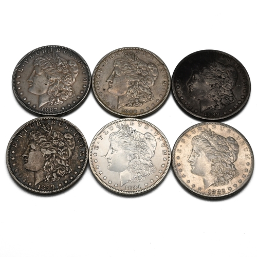 298 - A group of six United States silver 'Morgan' dollars, ( Morgan Dollars were issued between 1878 and ... 