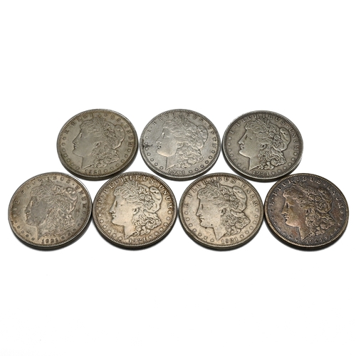 299 - A group of six United States silver 'Morgan' dollars. (Morgan Dollars were issued between 1878 and 1... 
