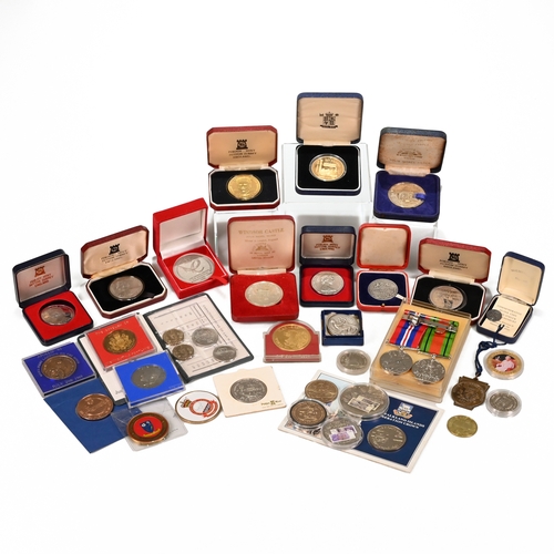 305 - An assortment of GB and world coins, medallions and tokens to include: WWII War and Defence Medal Pa... 