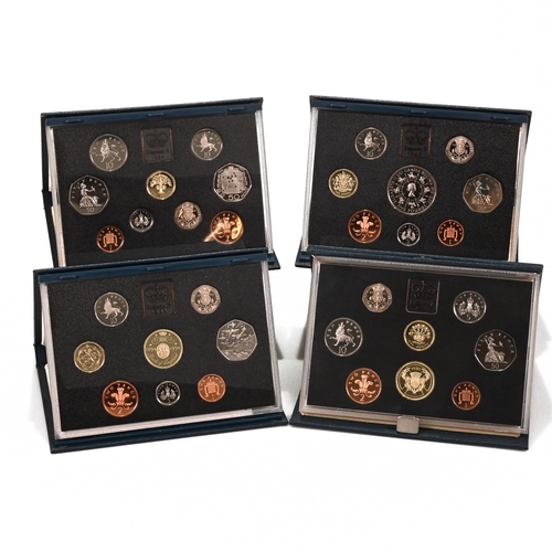 313 - Four Royal Mint Cased Proof Coin Sets to Include: the 1986 Proof Set with Commonwealth Games £2, Cer... 