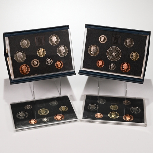 313 - Four Royal Mint Cased Proof Coin Sets to Include: the 1986 Proof Set with Commonwealth Games £2, Cer... 