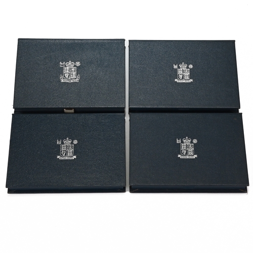 313 - Four Royal Mint Cased Proof Coin Sets to Include: the 1986 Proof Set with Commonwealth Games £2, Cer... 