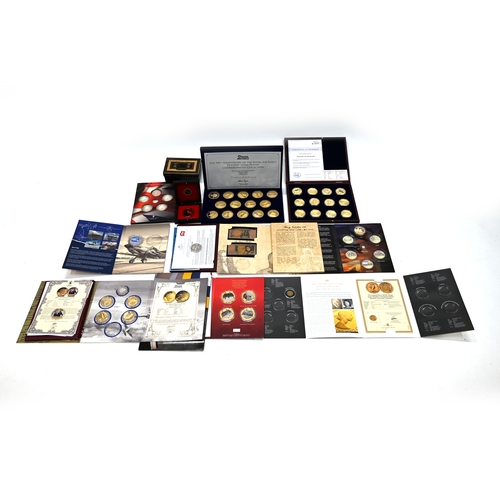 343 - A collection of Military and War related commemorative coins and medallions to include: History of A... 